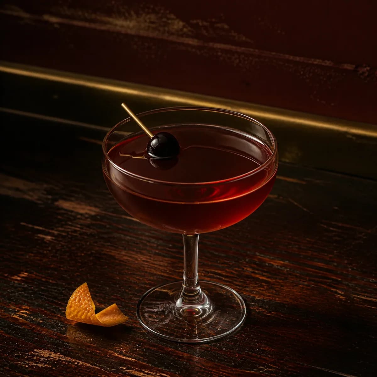 Fanciulli in a clear shallow coupe styled in a small jazz bar with oxblood plaster, old brass trim and scratched dark wood.