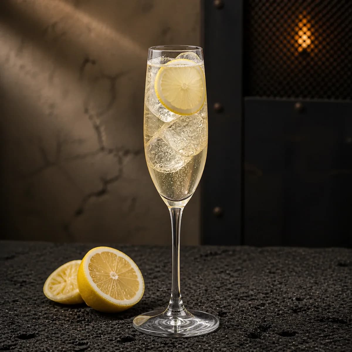 Mexican 55 in a slender champagne flute styled in a restrained modern mezcalería with blackened steel, pale clay render and rough volcanic stone.